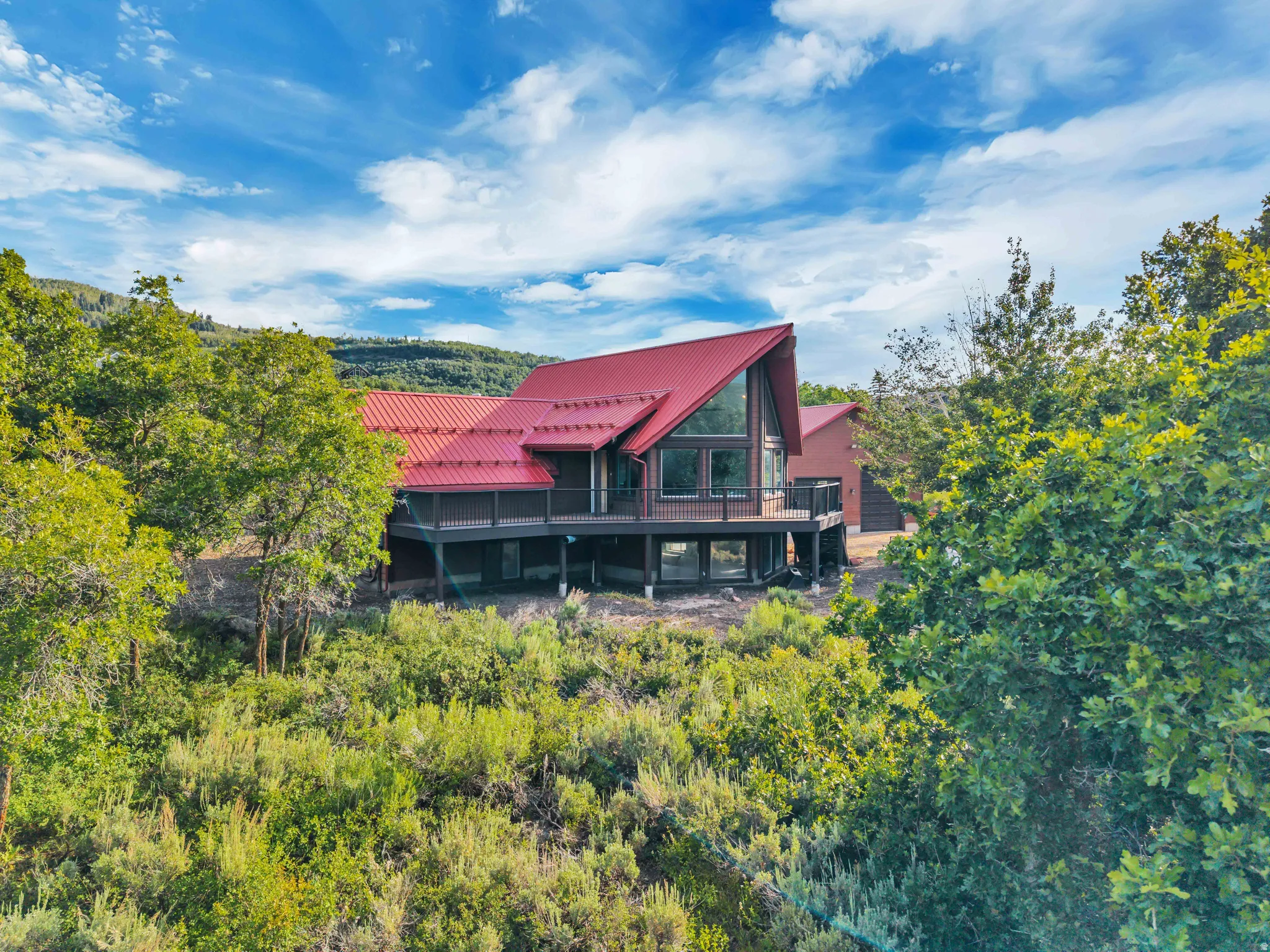 Contemporary architectural design featuring a prominent red metal roof