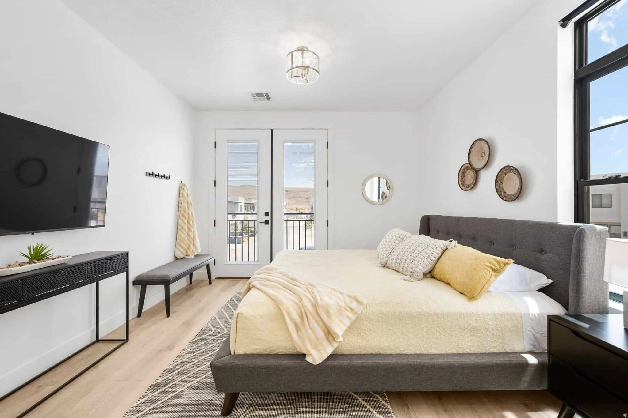 Bright room featuring wood-finish flooring and white walls