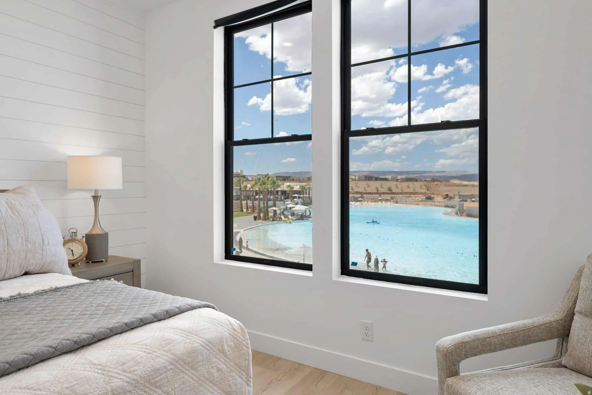 Dual picture windows showcasing a large outdoor lagoon
