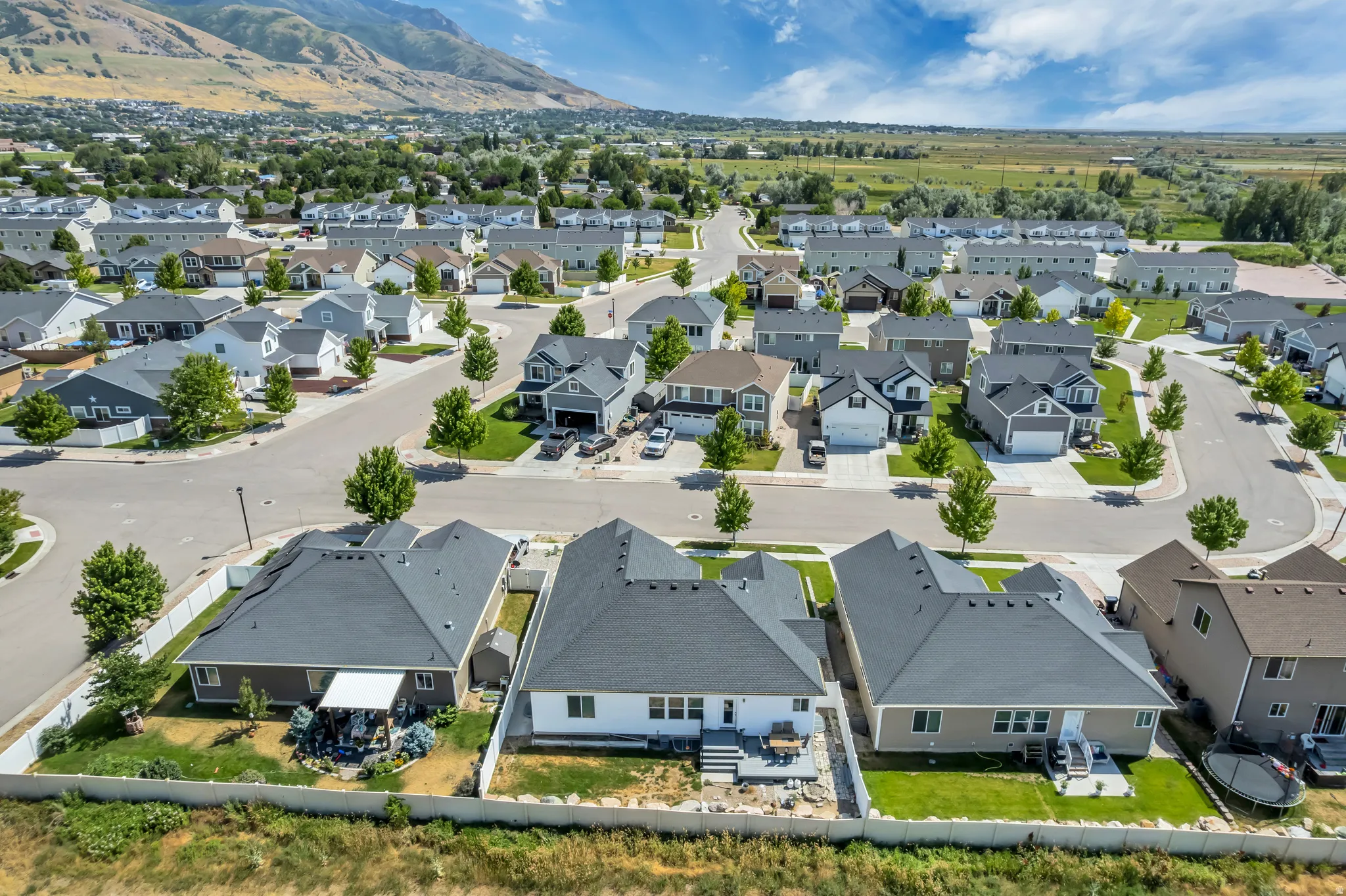 Aerial view of a residential neighborhood with a mountain backdrop
