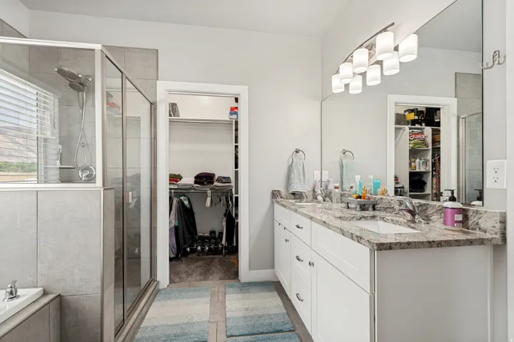 Double vanity with stone countertop and undermount sinks