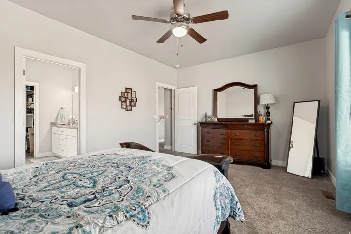 Neutral gray wall paint complementing gray carpeting