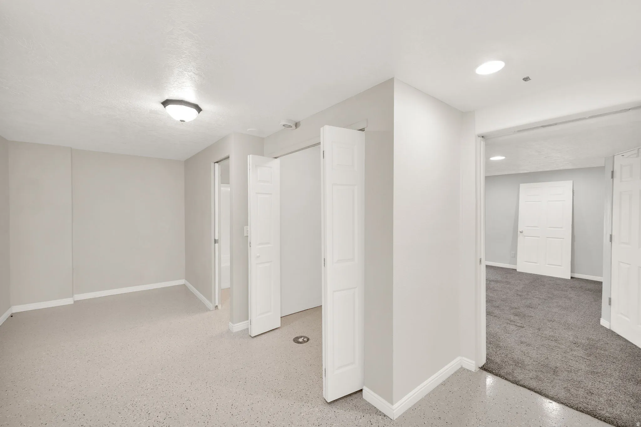 Room featuring light-colored carpeting, neutral painted walls, and white baseboards