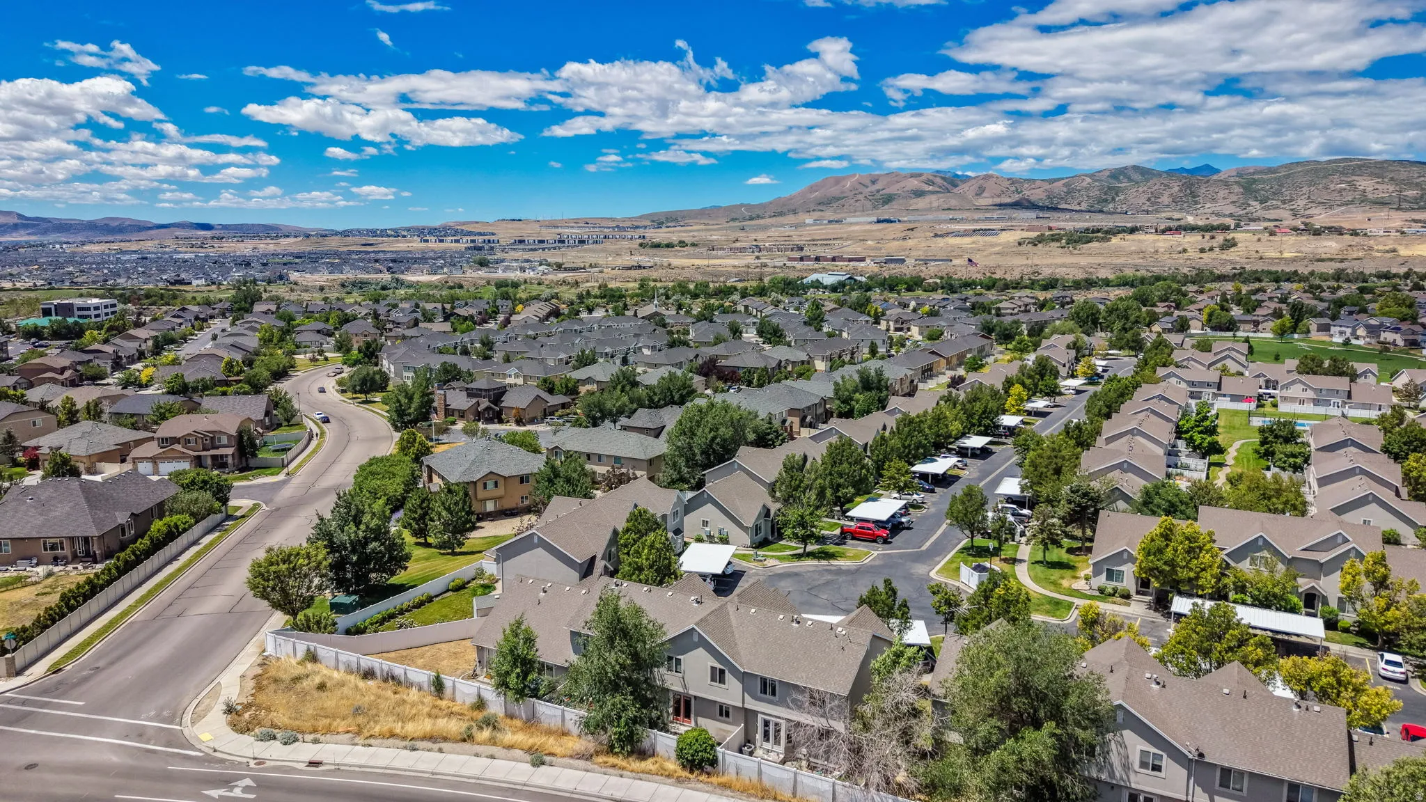 Expansive aerial showcasing a residential community with diverse housing styles
