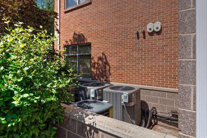 Brick exterior with multiple air conditioning units
