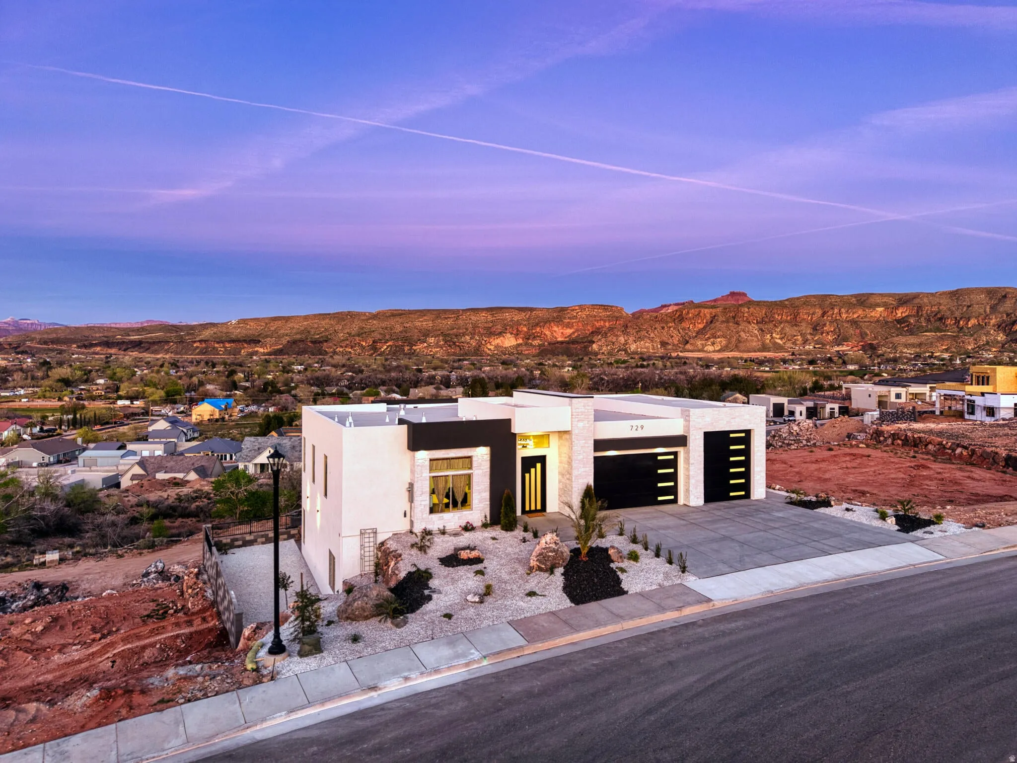Contemporary architecture with a striking facade featuring dark accents and large windows