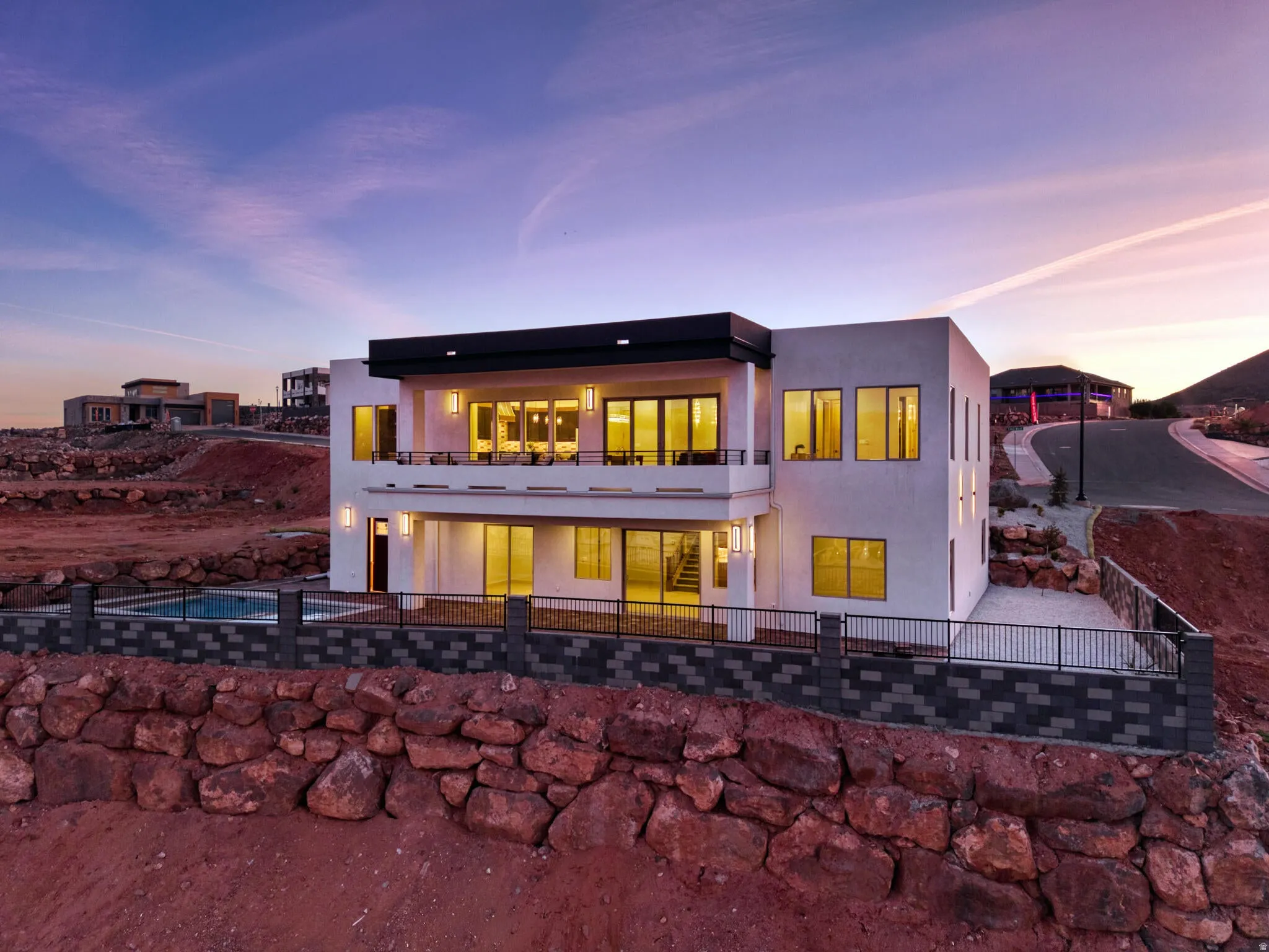 Contemporary multi-level residence featuring a sleek white exterior
