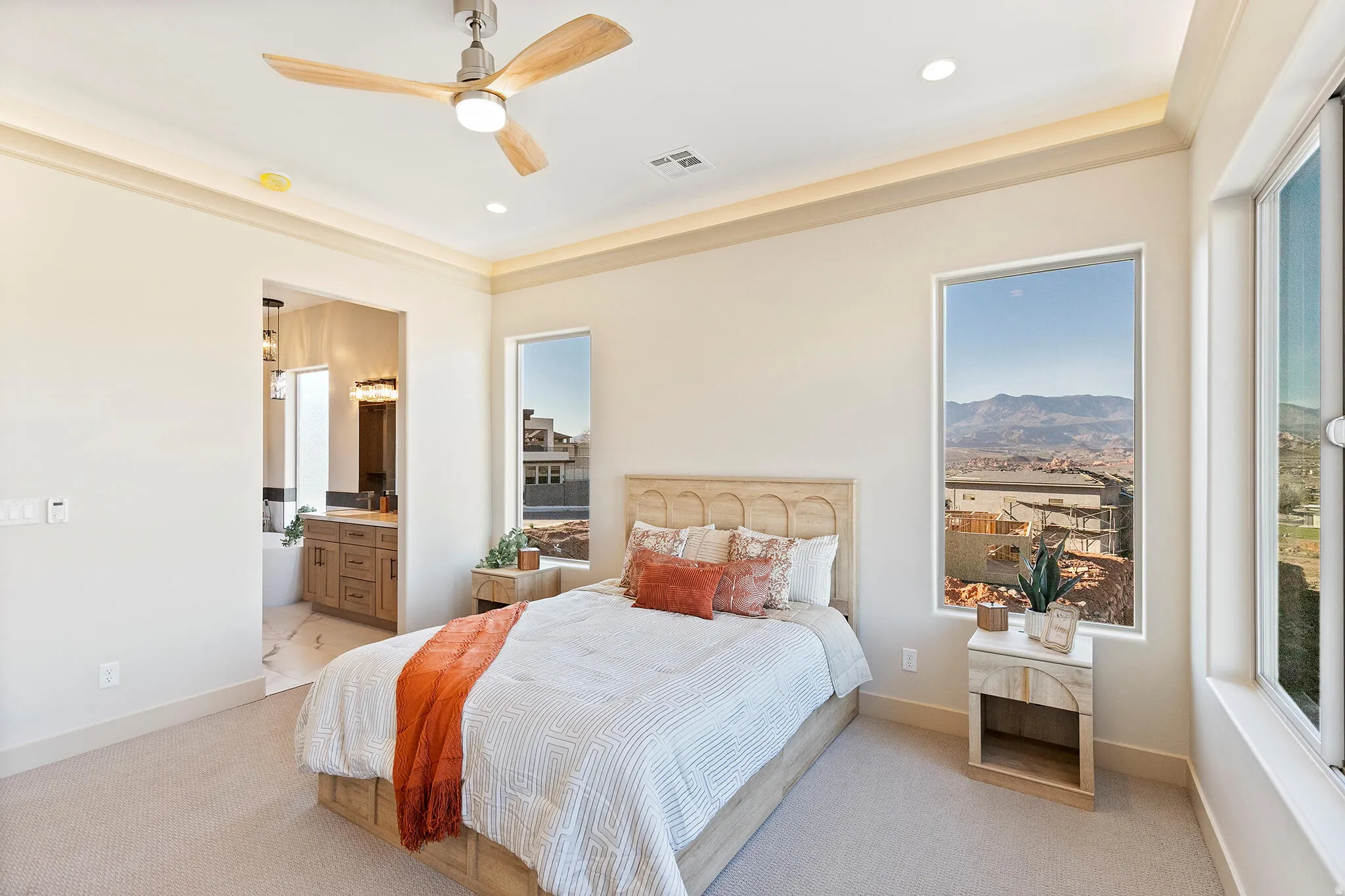 Well-appointed bedroom featuring a ceiling fan with integrated lighting, recessed ceiling lighting, and crown molding
