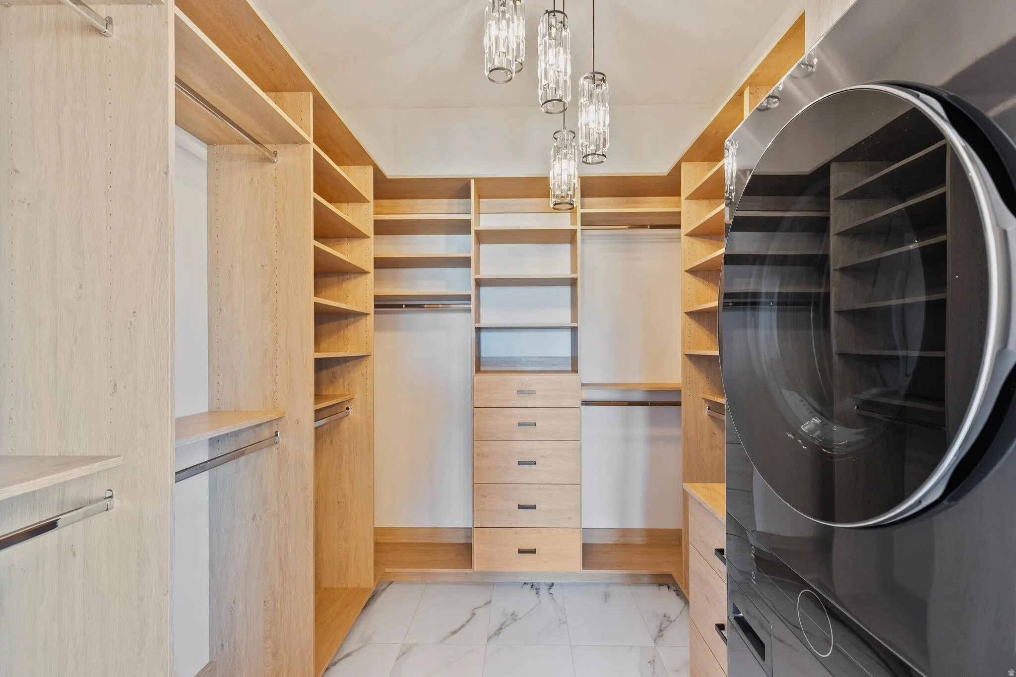 Custom closet system with integrated shelving and drawer storage