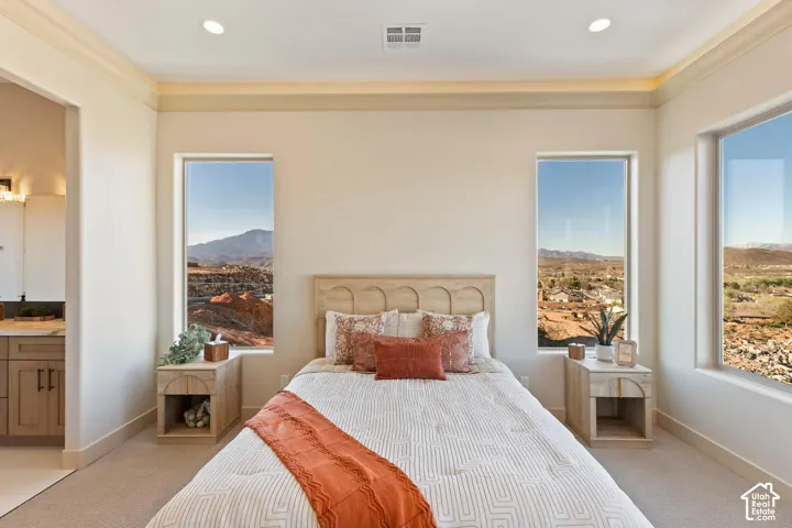 Bright interior space featuring recessed lighting, crown molding, and coved ceiling detail