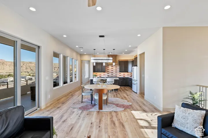 Open-concept living space with blonde wood-finish flooring
