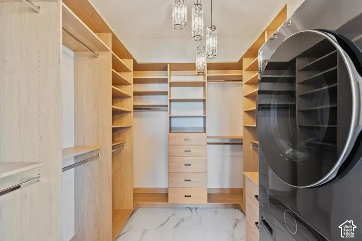 Custom closet system with integrated shelving and drawer storage