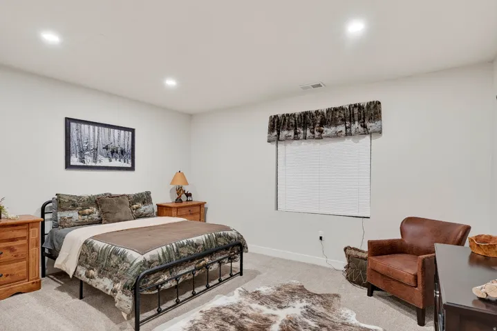 Carpeted room with recessed lighting