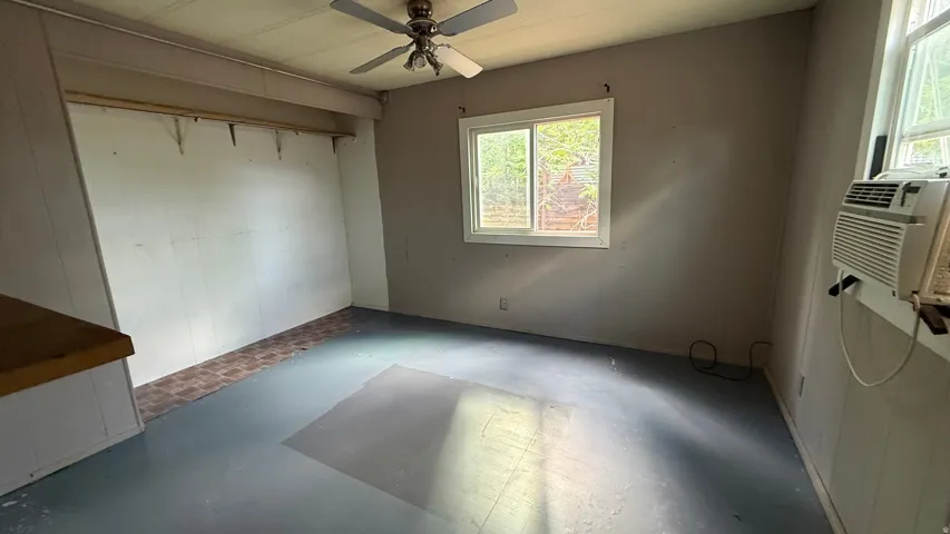 Window air conditioning unit, ceiling fan, and painted floor