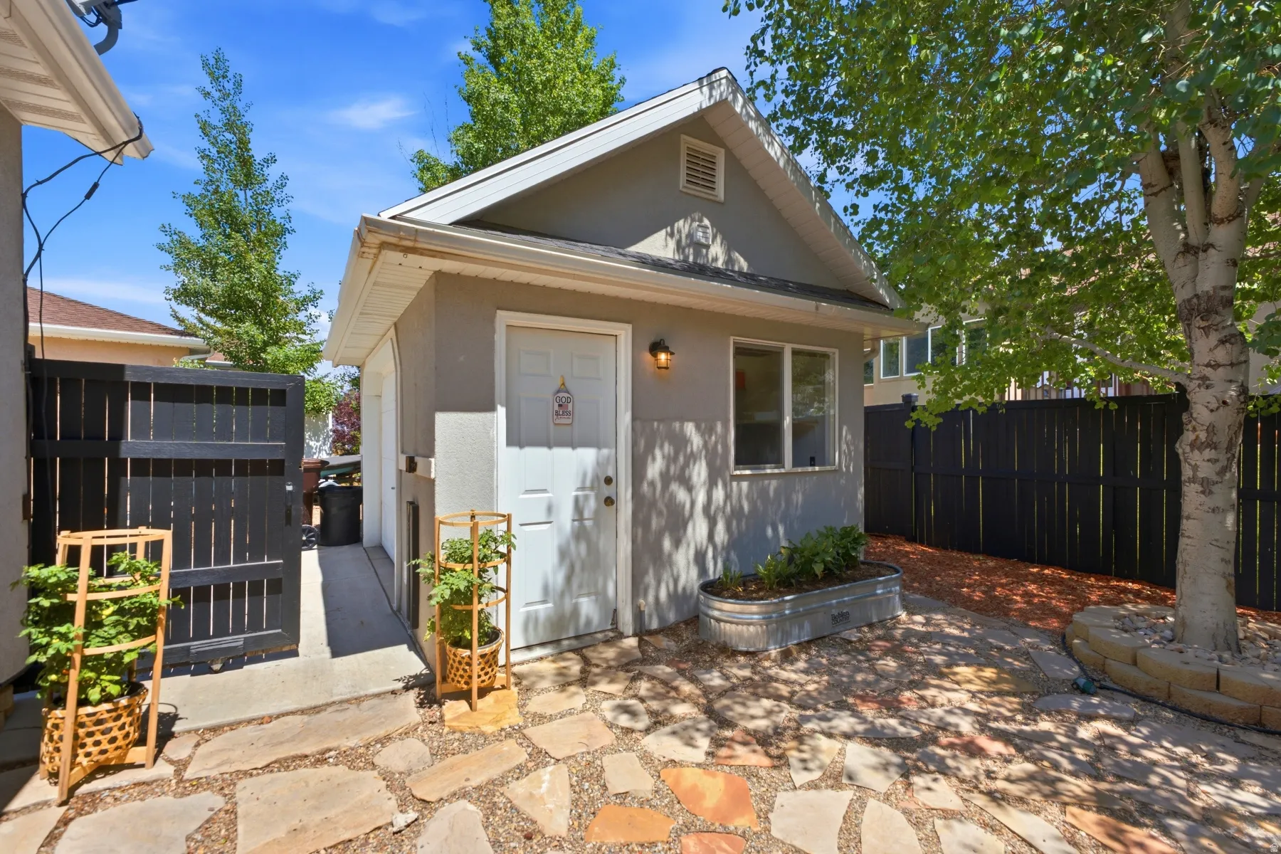 He SHED detached auxiliary structure featuring a gabled roofline and stucco exterior