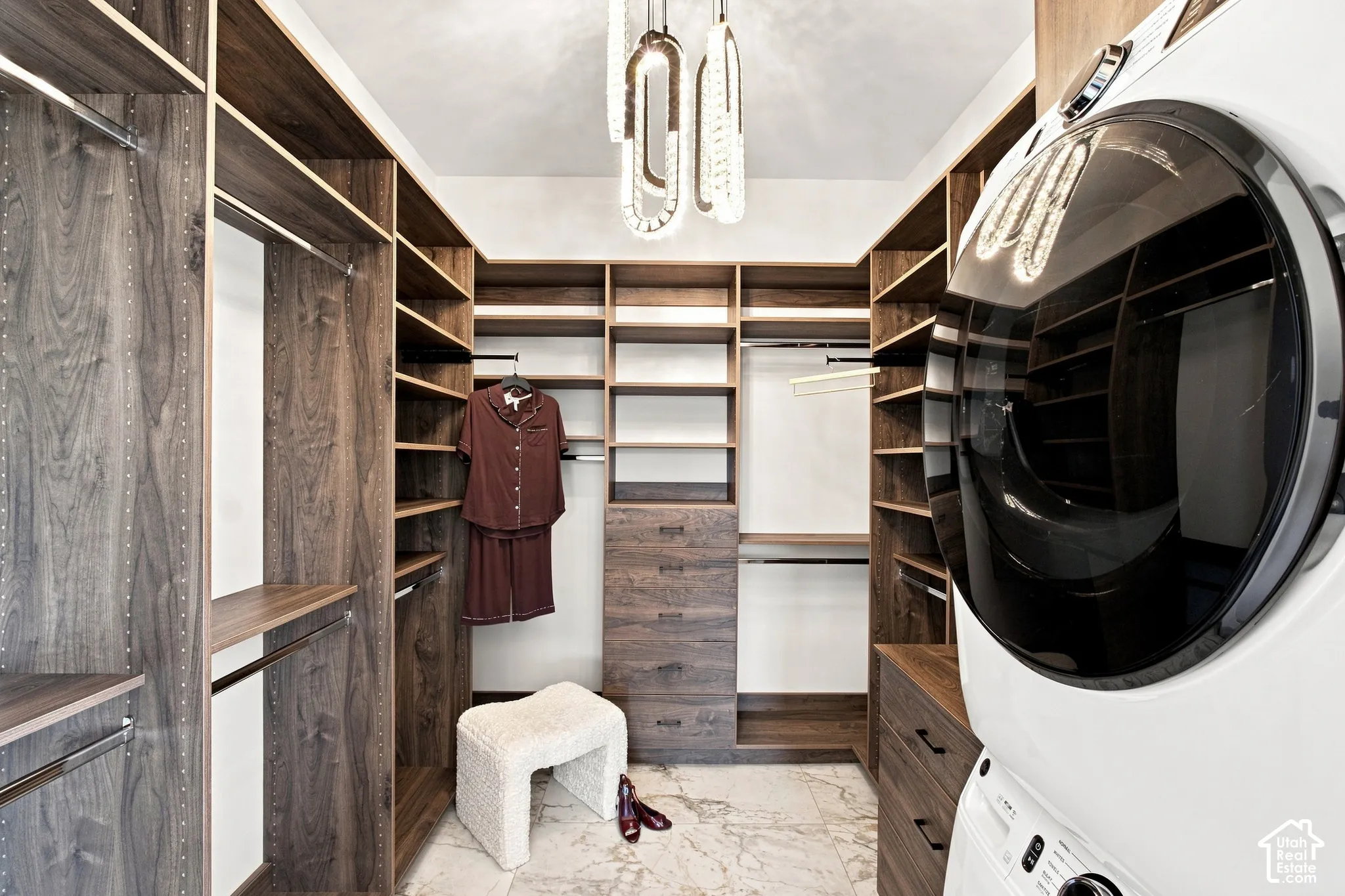 Custom closet system with wood-finish shelving and built-in drawers