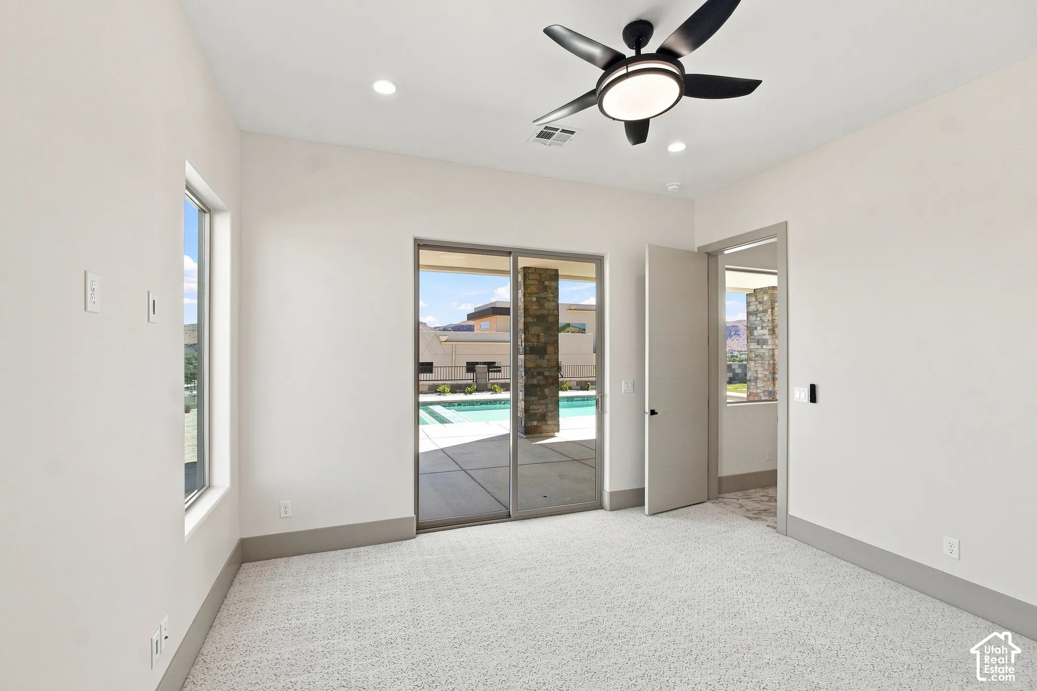 Recessed lighting and a contemporary ceiling fan with integrated lighting