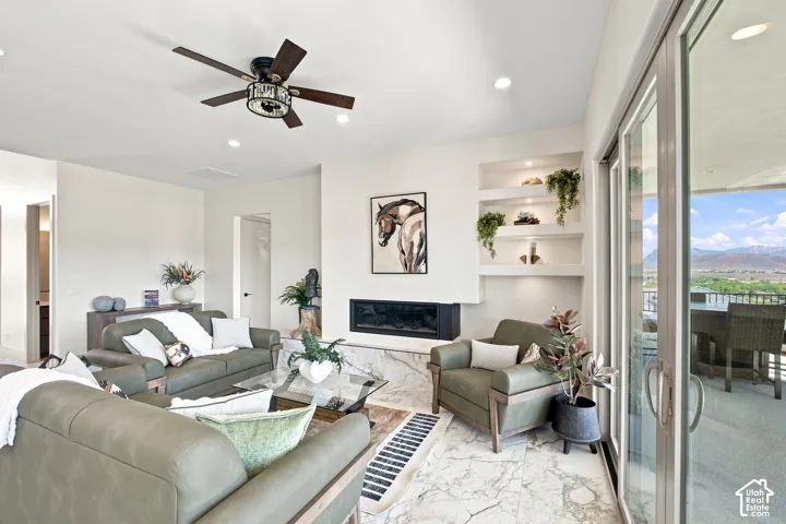 Recessed lighting in a spacious room with a ceiling fan