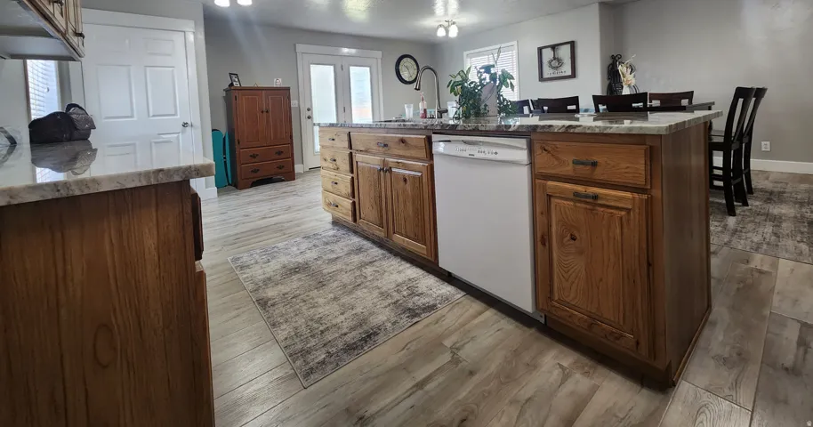 Updated cabinetry and granite counter tops.  Plenty of storage and built in pantry.