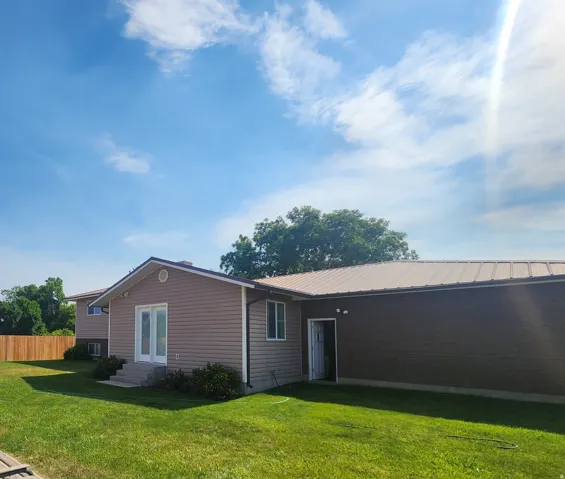 Backyard access from kitchen and garage doors.