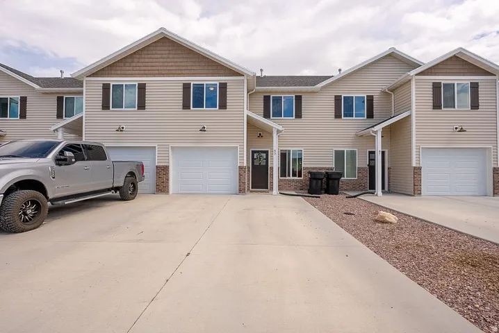 Exterior facade with horizontal siding, shake siding accents, and decorative shutters