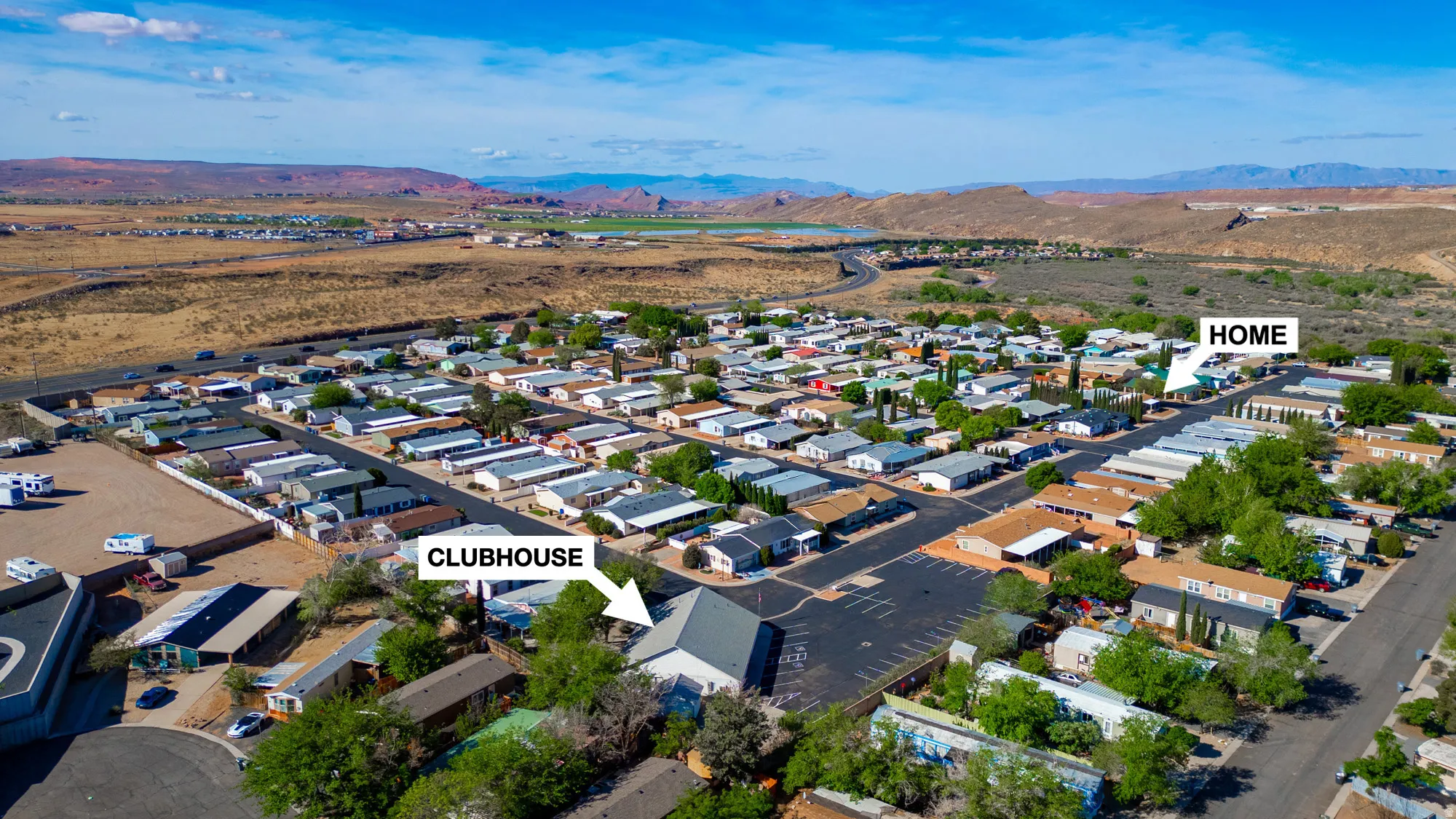 Community with paved streets and established residences, featuring a clubhouse