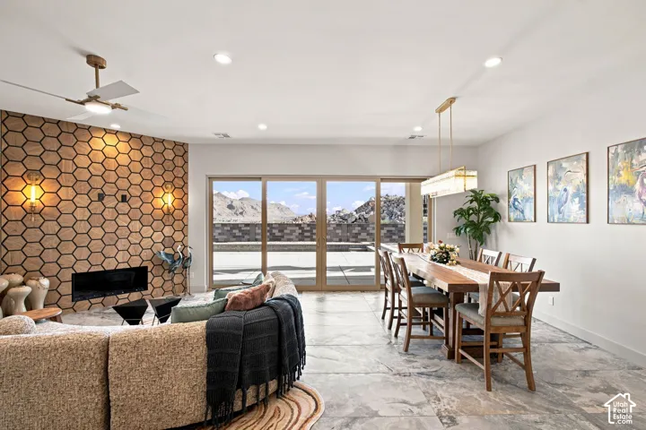 Spacious living area featuring a hexagonal wood-finish accent wall with a built-in fireplace