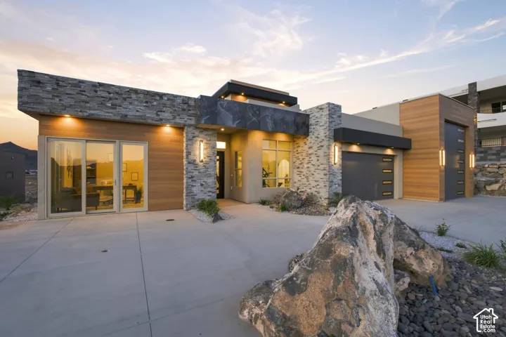 Contemporary architectural design featuring stone veneer and wood-finish siding
