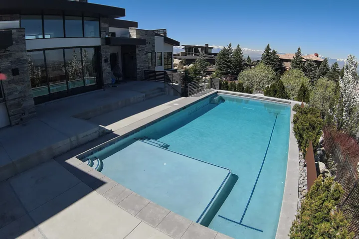 Modern exterior featuring extensive stone detailing and large format windows