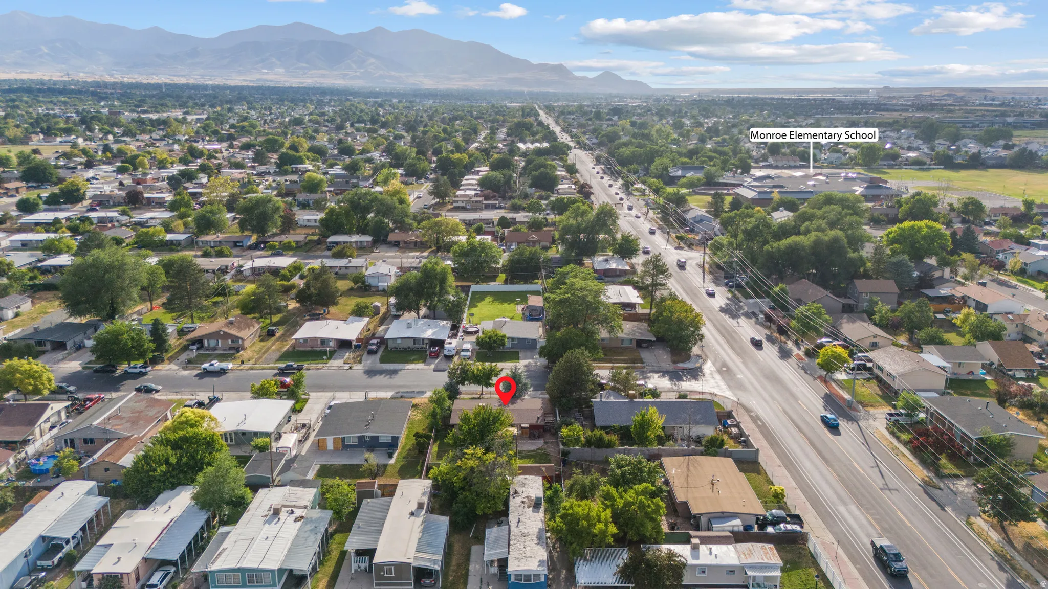 Aerial perspective showcasing a residential neighborhood with tree-lined streets