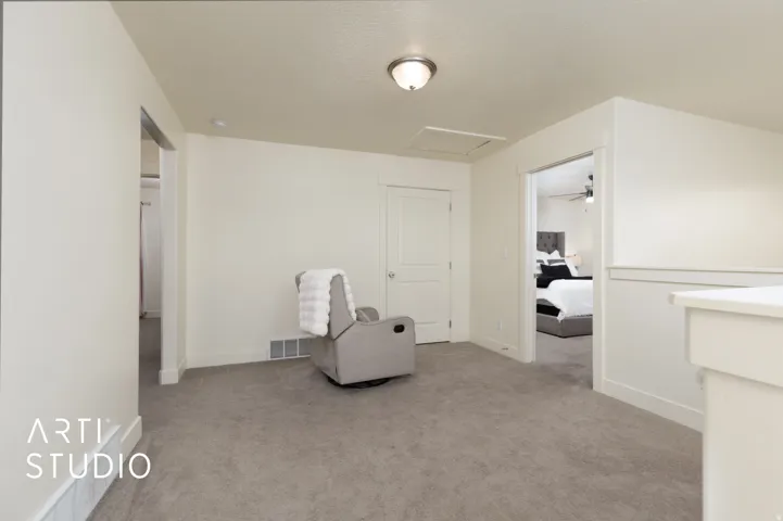 Neutral-toned carpeting and walls create a cohesive aesthetic in this interior space