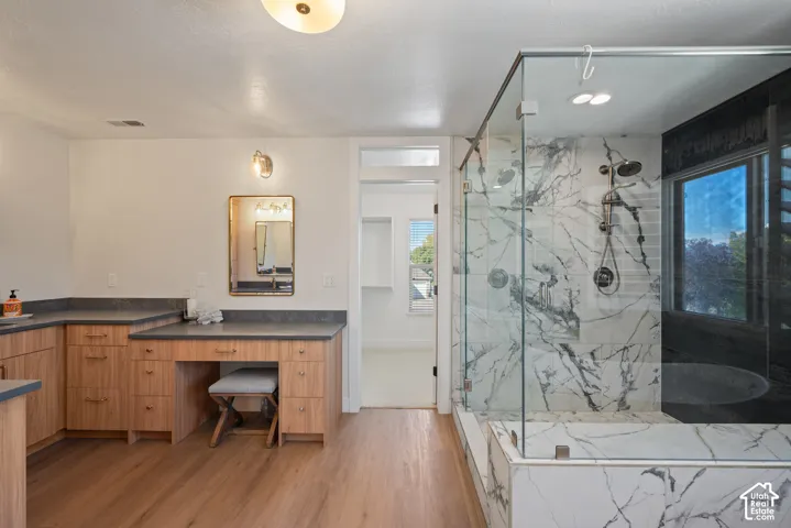 Spa-inspired primary bath thoughtfully configured with individual sink stations and a dedicated make-up table.
