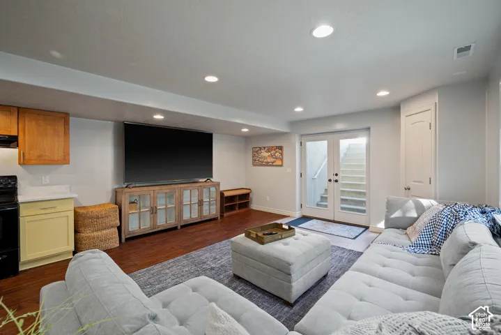 Convenient corner closet near the basement entry provides additional storage and leads naturally into the second kitchen.