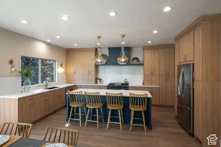 Architecturally thoughtful kitchen layout featuring quality dovetail wood cabinetry and contemporary finishes designed for both beauty and everyday function. Quartz countertops and expansive island provides bar seating for 4-5.