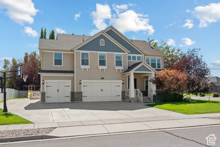 Overall view of the home's modern Craftsman architecture, two-story design, and three-car garage.
