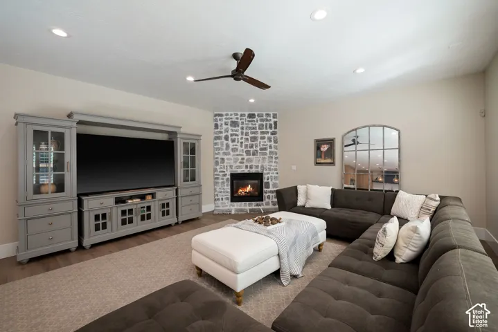 The great room's floor-to-ceiling stone fireplace provides a dramatic focal point and cozy warmth, with plenty of room for comfortable gathering and seating.