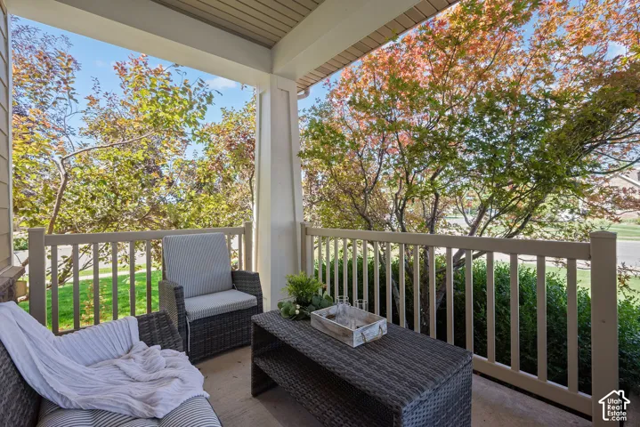 A rare and large covered outdoor entry porch extends the home's living space.