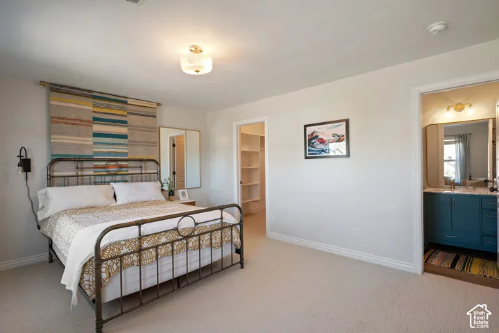 Convenient ensuite configuration combining a private bathroom with a walk-in closet for comfort and everyday functionality.
