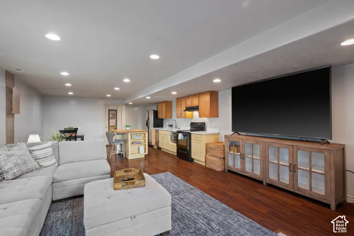 Overview of the 1,000+ sq. ft. basement apartment/ADU, offering a complete second living environment with living room, kitchen, multiple recessed-lighting zones, and a private entrance.