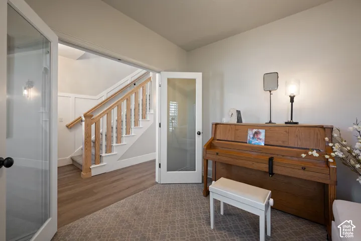 French doors open this front living room to natural light and the adjoining spaces, or close for added privacy when desired.