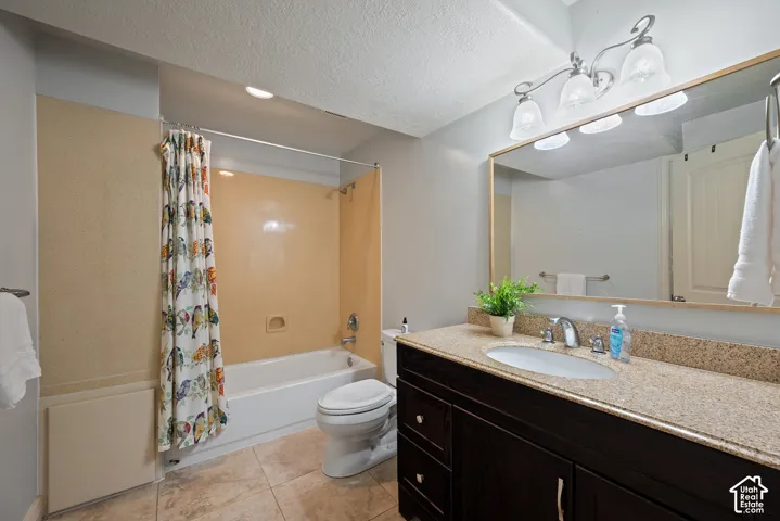 Full basement bath with a generously sized linen closet conveniently located within the bathroom.