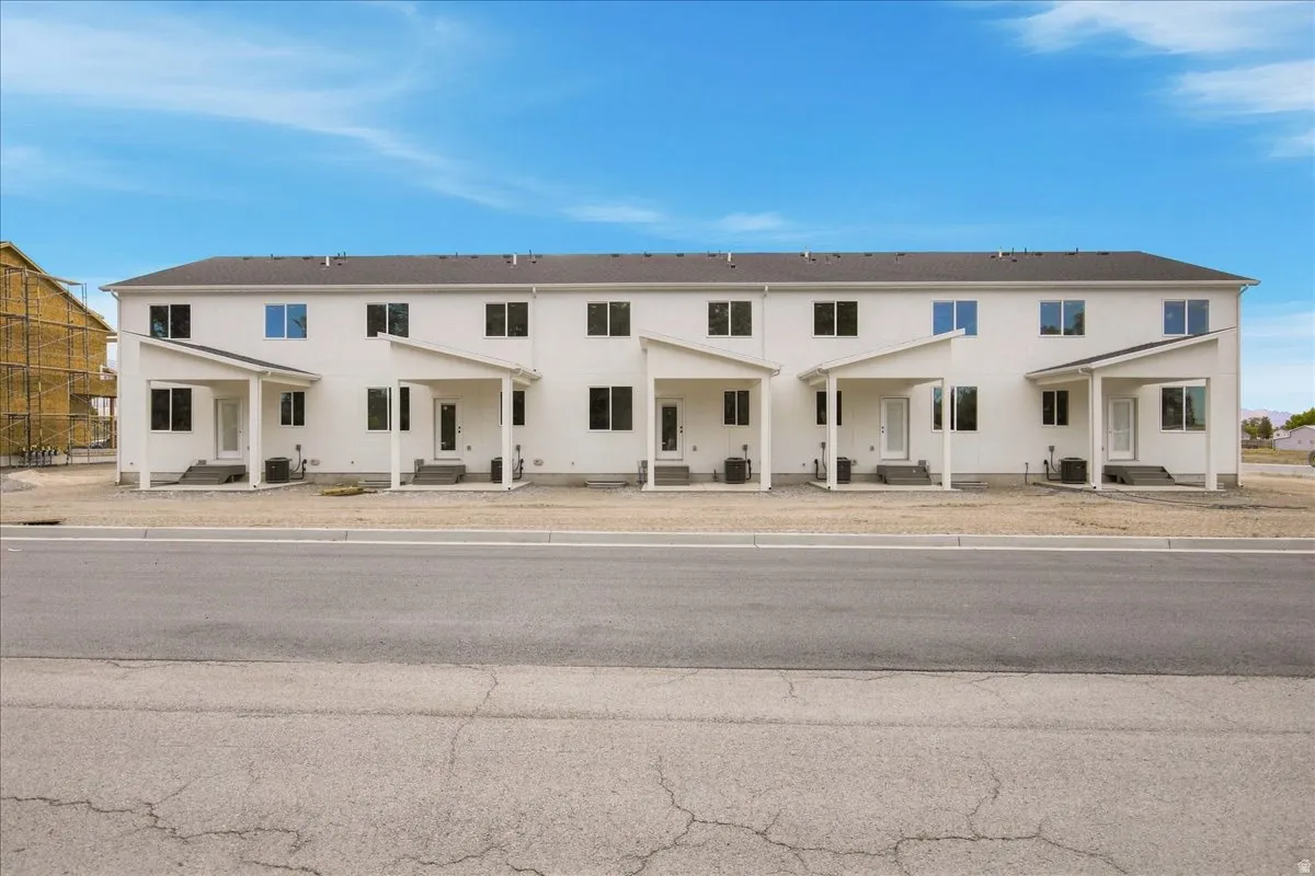 Backside of townhomes with covered patios.
