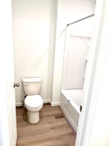 Secondary bath with separate room for the toilet and tub/shower.