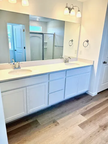 Dual vanity with undermount sinks and chrome faucets