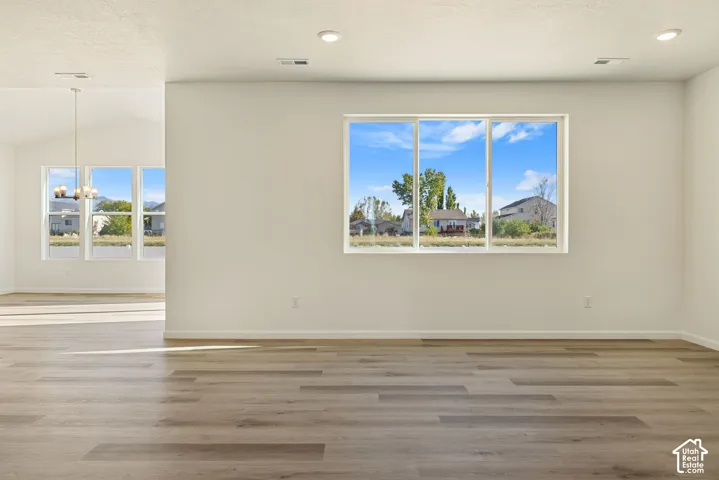 Open-concept Family/Great room is just past the front entry and office space. it features 9' ceilings and is just off the kitchen and dining room.