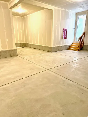 Large 3 car garage with a HUGE bonus shop space.