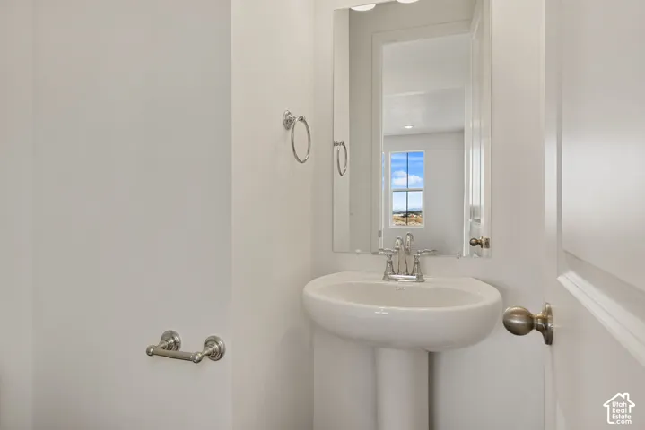 A half bathroom sits adjacent to the office with a convenient coat closet right in between.