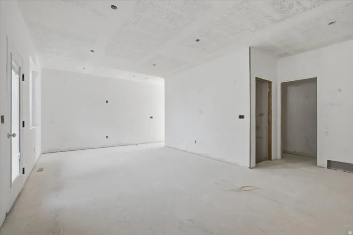 Living room area.  Door to Basement.  Door to Powder Room.