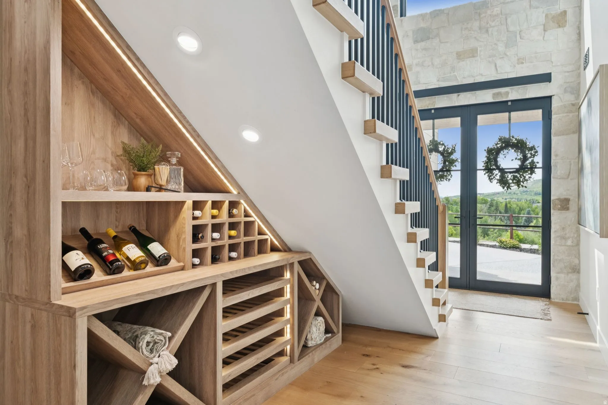 Custom under-stair built-in wine storage with integrated lighting