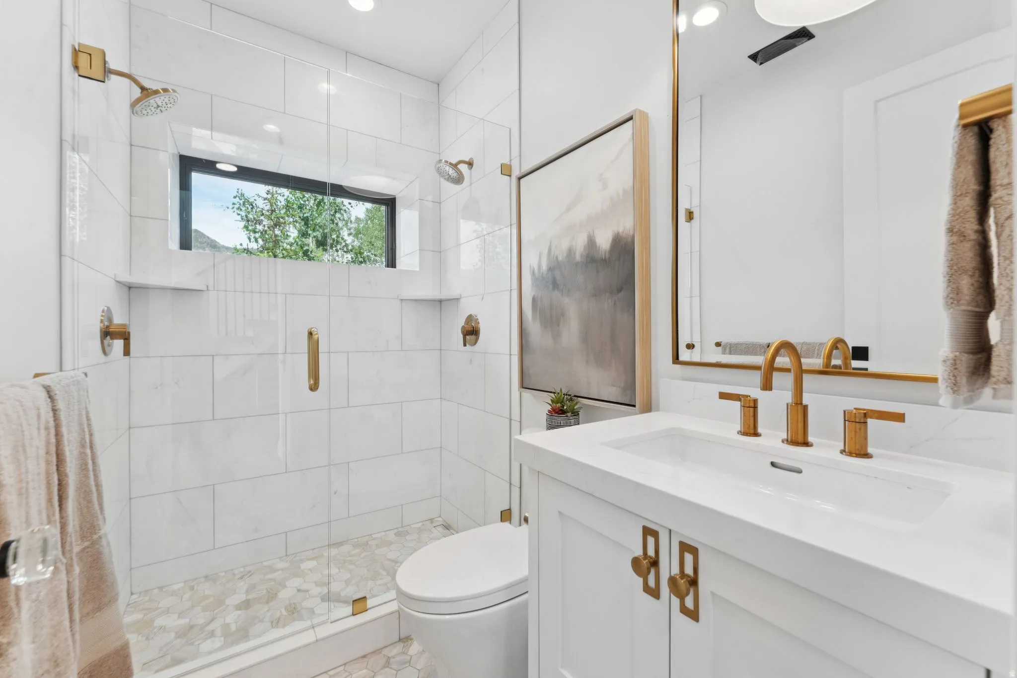 Walk-in shower featuring a glass enclosure, dual showerheads, and a horizontal window